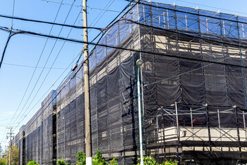 Obraz premium 足場のあるビルメンテナンスの建設現場