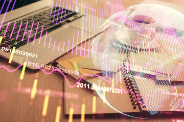 Obraz premium Multi exposure of forex graph drawing and desktop with coffee and items on table background. Concept of financial market trading