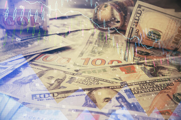 Multi exposure of forex chart drawing over us dollars bill background. Concept of financial success markets.