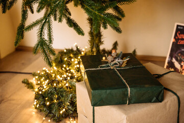 Lovely christmas tree with beautifuly packed presents boxes under it