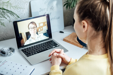 Young woman student applicant having online virtual video call job interview meeting with female hr...