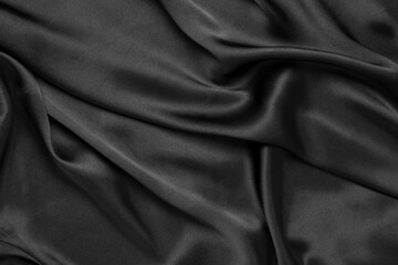 Fototapeta premium Abstract black background luxury cloth or liquid wave or wavy folds of grunge silk texture satin velvet material or luxurious
