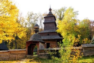 Old wooden church in autumn sunny day