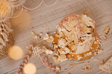 Smashed cake on the floor for first birthday. Messy pieces