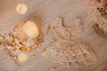 Smashed cake on the floor for first birthday. Messy pieces