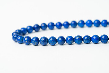 blue beads on white background