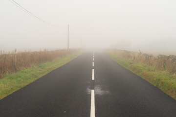 Fog on a rural road in Northumberland, Uk