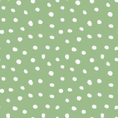 Abstract seamless background with hand drawn polka dots, green and white pattern © Marina Demidova