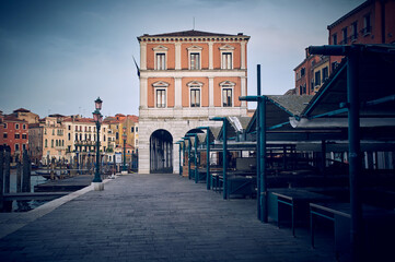 Empty Venice Rialto market place at the evening without anybody on the street with the stands on...