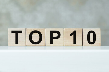 Top 10 sign made of wooden dices on table. Business, career and education concept