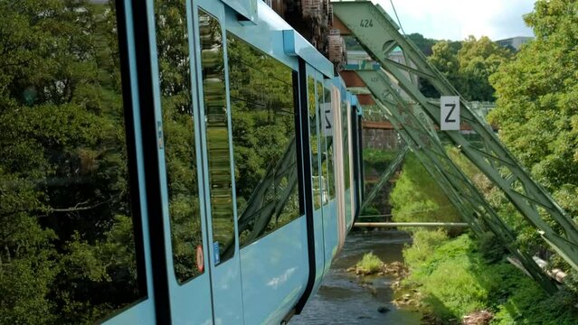 Germany, Wuppertal, Circa 2022. Wuppertal Suspension Railway in front of a train.