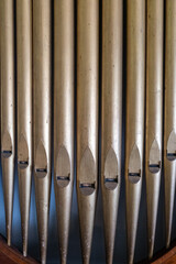 organ pipes in a wooden frame