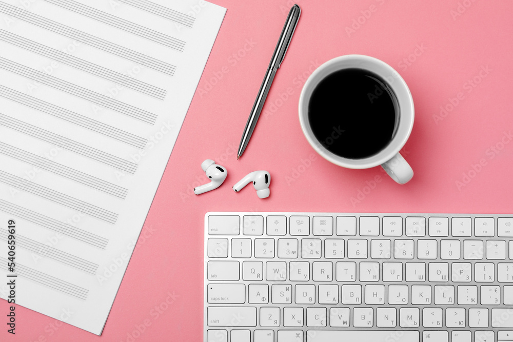 Poster notebook for writing notes and a cup of coffee on a pink background
