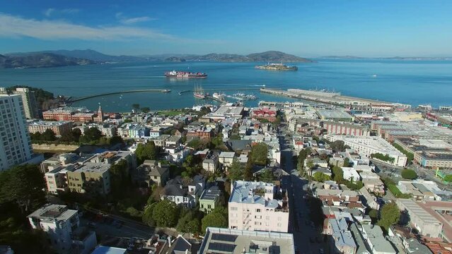 Aerial Shot Of Residential Buildings By Port On Sea, Drone Flying Downwards During Sunny Day - San Francisco, California