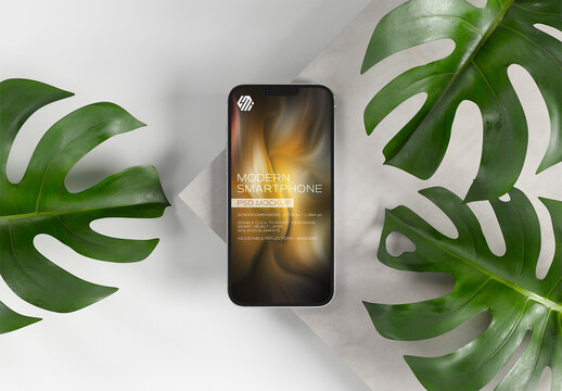 Mobile Phone Mockup On Concrete Display with Leaves