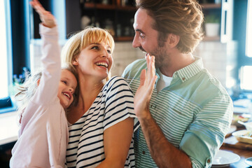 Naklejka premium Happy family having fun time at home. Parents child love concept.