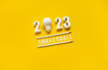 2023 smart goals,idea and creativity with text number and lightbulb.
