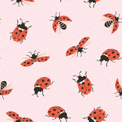 Vector insect seamless pattern. Hand-drawn ladybugs on the pink polka dots  background.  Vector spring illustration.