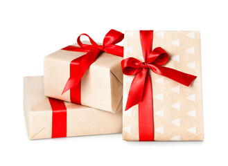three beige gift boxes with red bows on a white isolated background