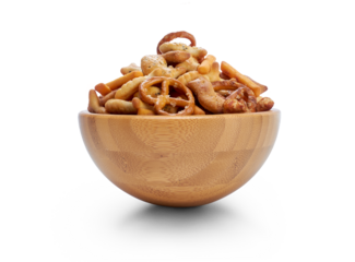 A snack bowl of salted savoury party food, crispy nibbles isolated against a transparent background viewed from the side.