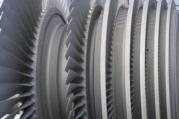 Close view on low-pressure turbine rotor with shrouded and standing blades used in nuclear power...