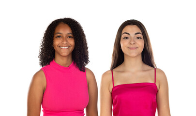 Photo of a positive smiling pleased young multiethnic girls friends posing in pink clothes