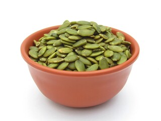 Green pumpkin seeds in a bowl 