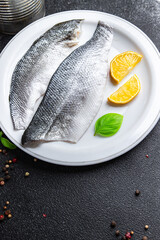 raw fish sea ​​bass fillet seafood snack on the table copy space food background