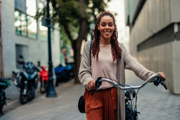 Portrait of urban woman with bicycle.