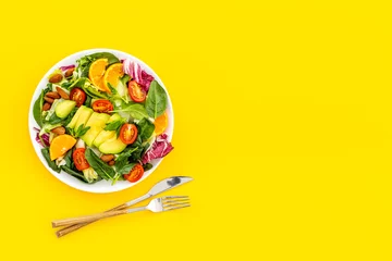 Fotobehang Bowl of green salad with avocado and tomatoes. Healthy vegetarian lanch © 9dreamstudio
