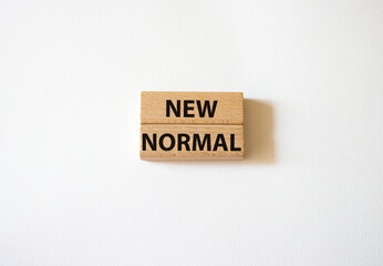 New normal symbol. Wooden blocks with words New normal. Beautiful white background. Business and...