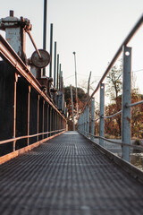 rusted industrial bridge in autumn