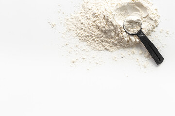 Whey protein powder on scoop. Fitness and gym diet nutrition