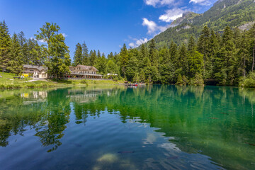 Obraz premium View of Blausee (The Blue lake) in Bernese Oberland, famous tourist destination in Switzerland