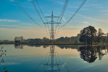 Power line reflection in lake. High quality photo