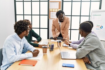 Fototapeta premium Group of young african american business workers smiling happy working at the office.