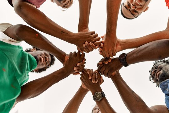 Group Of Young African American Artist Man Smiling Happy And Holding Hands Together At Art Studio.