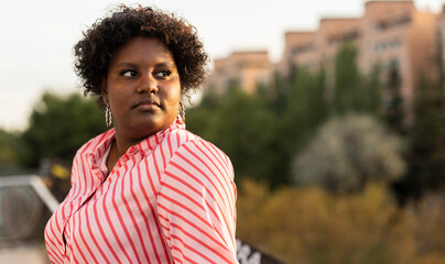 Portrait of black confident woman outdoors
