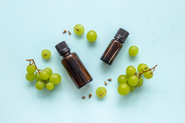 Bottles of grape seed essential oil. Massage body care cosmetic product