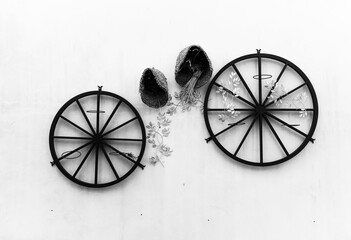 Cycle shape meant for a bicycle on a white background with a broken flower