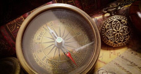Vintage style travel and adventure. Vintage old compass and other vintage items on the table.