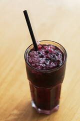 Glass of blueberry lemonade isolated