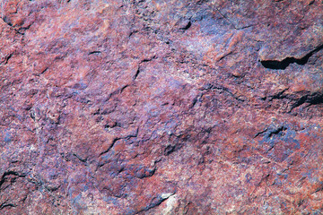 Colorful rough rock wall. Abstract background texture