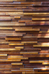 Multi-level wooden texture made of wooden bars of different sizes and colors