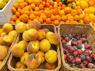 buying fruits(grape,apricots and peaches)  at the market
