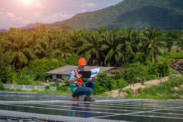 Solar panel energy,Electrical engineer man is working in solar station on roof using equipment,Alternative energy to conserve the world's energy.