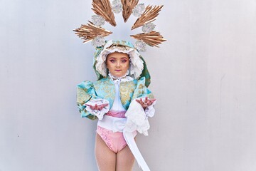 Adorable child wearing virgion custom over isolated white background