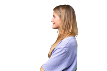 Young beautiful woman over isolated background in lateral position