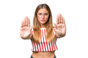 Young beautiful woman over isolated background making stop gesture and disappointed