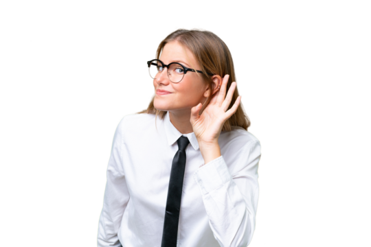 Young business caucasian woman over isolated background listening to something by putting hand on the ear
